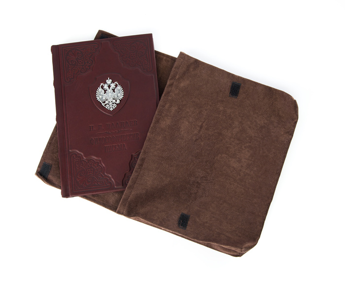 The leather-bound book "Philosophical Letters" by Chaadaev